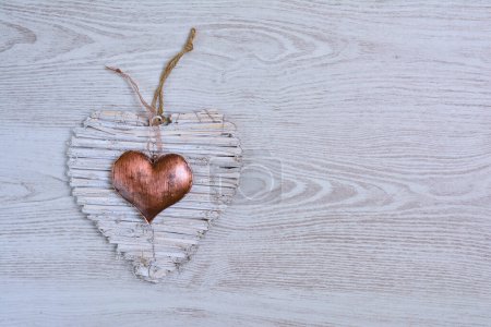 Photo for Handmade hearts lying on wooden table - Royalty Free Image