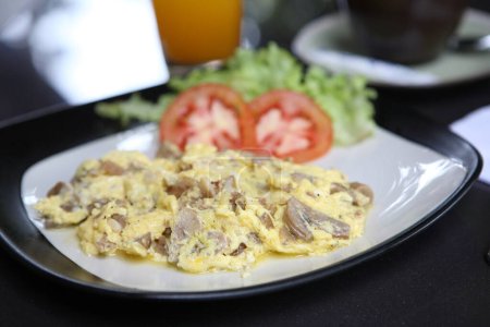 Photo for Close-up shot of Omelette with mushroom and bacon - Royalty Free Image