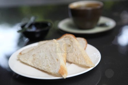 Photo for Slice of bread with coffee, close up - Royalty Free Image