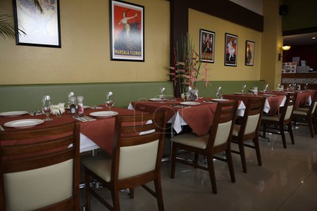 Photo for Interior of a restaurant, tables of chairs - Royalty Free Image