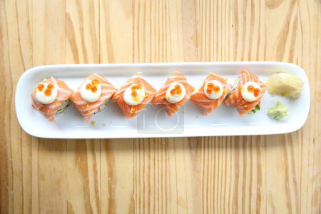 Photo for "Salmon rolls. Tasty Japanese seafood concept - Royalty Free Image