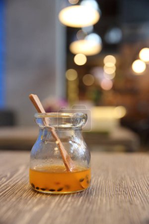 Photo for Tea in a glass jar on a wooden table - Royalty Free Image