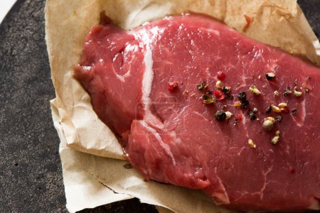 Photo for Raw beef tenderloin with peppercorns. - Royalty Free Image
