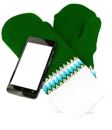 Téléchargez les photos : "mitaines tricotées vertes et blanches avec téléphone cellulaire isolé sur fond blanc
" - en image libre de droit