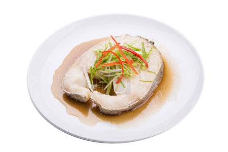 Photo for Snow fish steamed in soy sauce in a white plate - Royalty Free Image