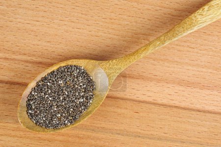 Téléchargez les photos : Chia (cia) seeds in wooden spoon - en image libre de droit