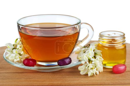 Téléchargez les photos : Tasse de thé, miel d'acacia et fleur - en image libre de droit