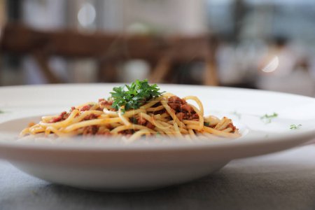 Photo for Spaghetti bolognese with beef tometo sauce on wood table - Royalty Free Image