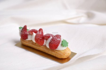 Photo for "Choux cream with strawberry isolated in white background" - Royalty Free Image