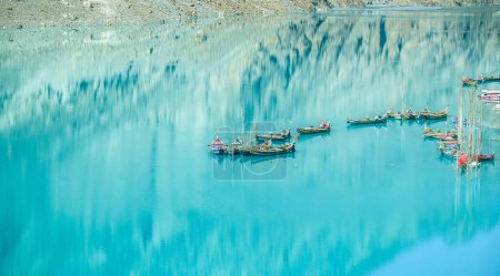 Photo for Turquoise Attabad lake with reflection of mountain - Royalty Free Image
