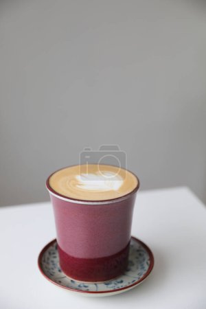 Photo for Cappuccino or Latte art coffee made from milk on the wood table - Royalty Free Image