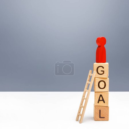 Photo for The red person climbed a tower of GOAL blocks. Developing strategy. Attracting investment and financial resources for a successful business startup. Using tools to solve problems, achieve success. - Royalty Free Image