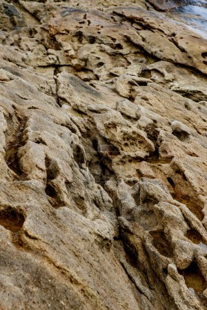 Foto de Texture of coastal old stone. Rock wallpaper. - Imagen libre de derechos