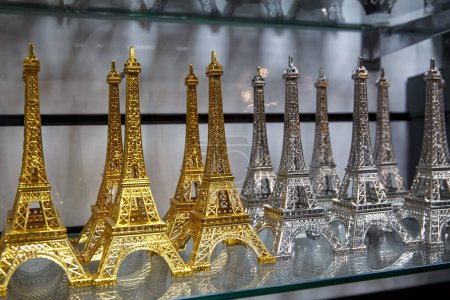 Photo for Row of mini Eiffel towers. Souvenir from Paris, France. - Royalty Free Image