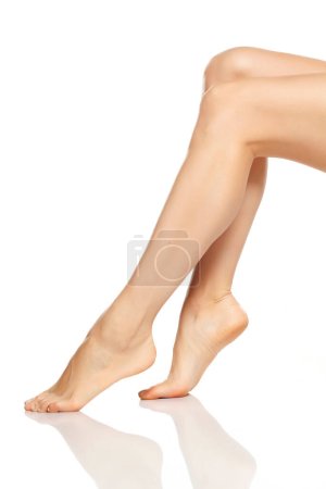 Photo for Beautiful female legs on white background - Royalty Free Image