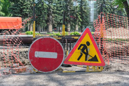 Photo for Road signs warning of construction work and a ban on travel - Royalty Free Image