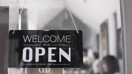 Photo for Welcome sign with open sign on a door - Royalty Free Image