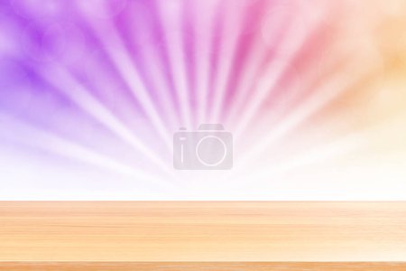 Foto de "empty wood table floors on soft purple bokeh lights beam shine gradient background, wooden plank empty on purple bokeh colorful light shine, colorful bokeh lights gradient soft for banner advertising" - Imagen libre de derechos