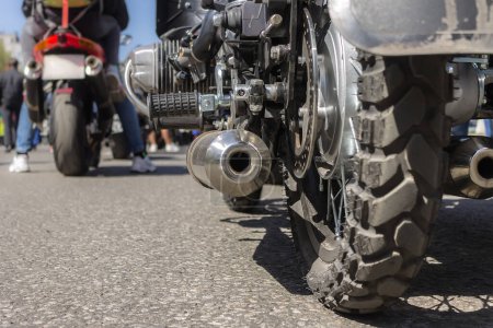 Photo for Motorcycle rear wheel and exhaust pipe - Royalty Free Image
