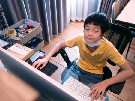 Photo for Asian boy studying at home - Royalty Free Image