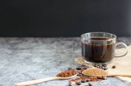 Photo for Closeup ground coffee in wooden spoon and fresh roasted coffee beans - Royalty Free Image