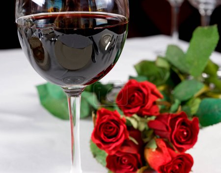 Photo for Red wine and roses - Royalty Free Image