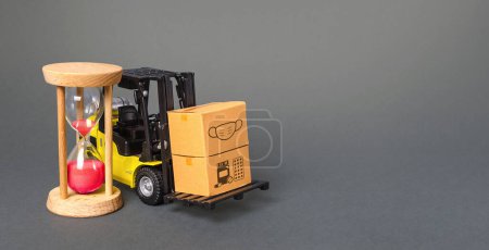 Photo for "Forklift with boxes and hourglass. Urgent delivery of medicines and medical protective masks. Supply hospitals and populations to stop spread COVID-19 coronavirus, contain padnemia. Express shipping" - Royalty Free Image