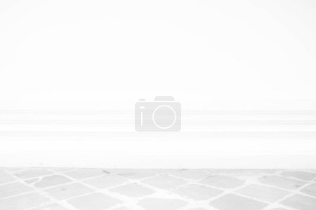 Photo for White Concrete Wall with Pavement. - Royalty Free Image