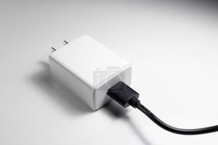 Photo for White charger adapter on a white background - Royalty Free Image