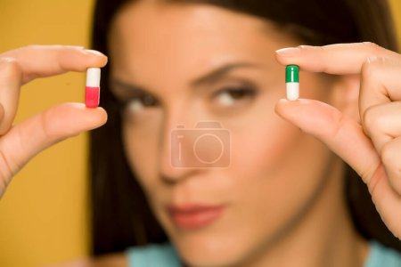 Photo for Closeup view of woman holding capsules - Royalty Free Image