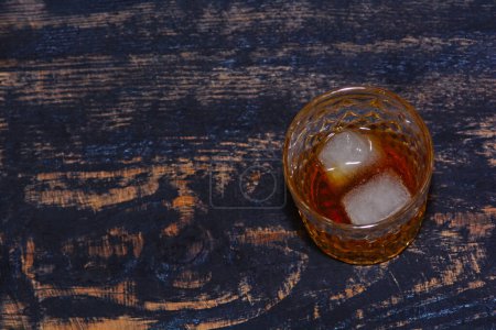 Photo for Whiskey in glass with cubes of ice - Royalty Free Image