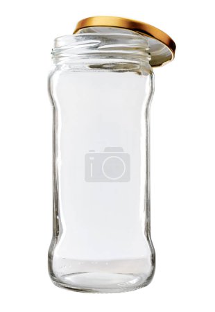 Foto de Tarro de vidrio alto con tapa dorada sobre fondo blanco - Imagen libre de derechos