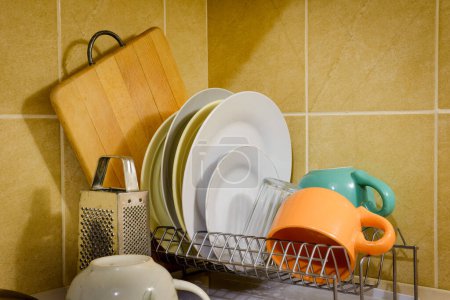 Photo for Dishes and Tableware Drying in Kitchen - Royalty Free Image