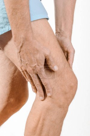 Photo for Athlete man feeling pain to the knee and to the quadriceps - Royalty Free Image