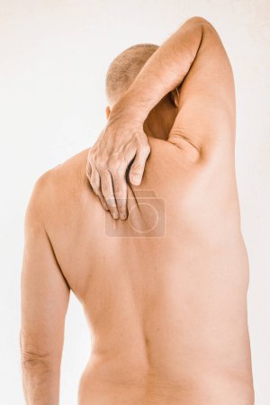 Photo for Man suffering of thoracic vertebrae pain - Royalty Free Image
