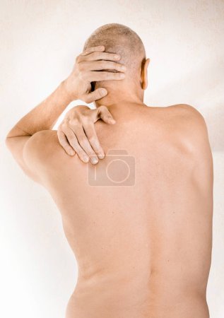Photo for Man suffering of thoracic vertebrae or trapezius muscle pain - Royalty Free Image