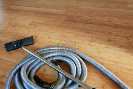 Photo for Vacuum cleaner on wooden floor - Royalty Free Image