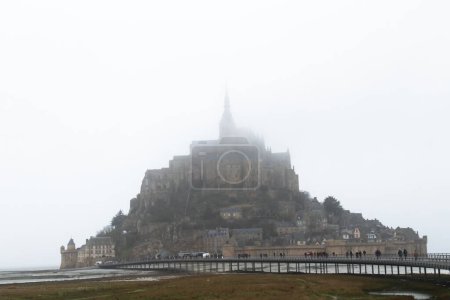 Photo for Mont Saint Michel is a small UNESCO World Heritage site located on an island just off the coast of the region of Lower Normandy in northern France - Royalty Free Image