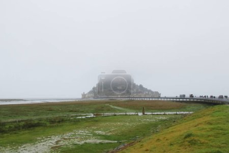 Photo for Mont Saint Michel is a small UNESCO World Heritage site located on an island just off the coast of the region of Lower Normandy in northern France - Royalty Free Image