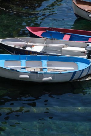 Photo for Colored boats on the blue sea. Riomaggiore, Cinque Terre. - Royalty Free Image