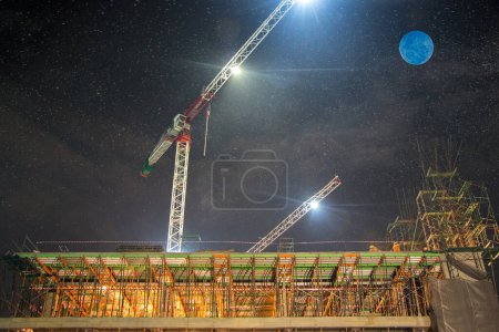 Photo for Construction at night with lights against the dark sky - Royalty Free Image