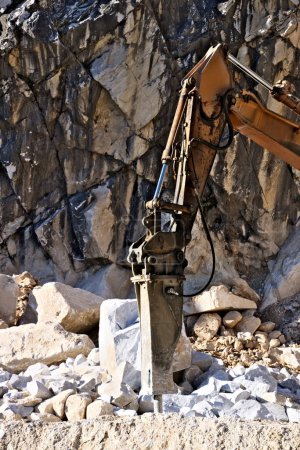 Photo for Demolition hammer in a quarry of white Carrara marble. - Royalty Free Image
