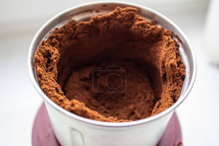 Photo for Ground coffee in a coffee grinder - Royalty Free Image