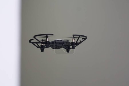 Photo for Back aspect of UAV or drone fly in room - Royalty Free Image
