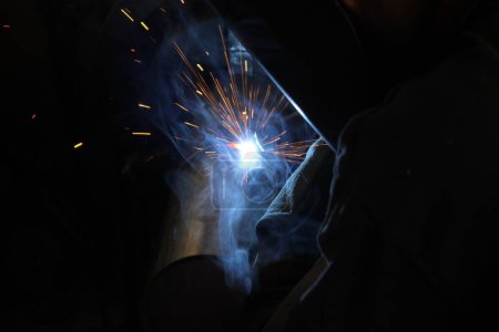 Photo for Welder working with steel at industrial factory - Royalty Free Image