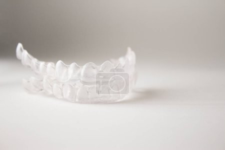 Photo for Invisible orthodontics on white background - Royalty Free Image