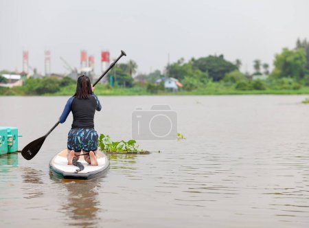 Photo for SUP / Stand up Paddle Board Get ready . Happy woman - Royalty Free Image
