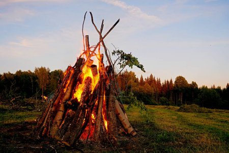 Photo for Midsummer bonfire, evening view - Royalty Free Image