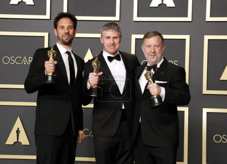 Foto de Guillaume Rocheron, Dominic Tuohy, Greg Butler posando en la presentación de los Premios Óscar - Imagen libre de derechos
