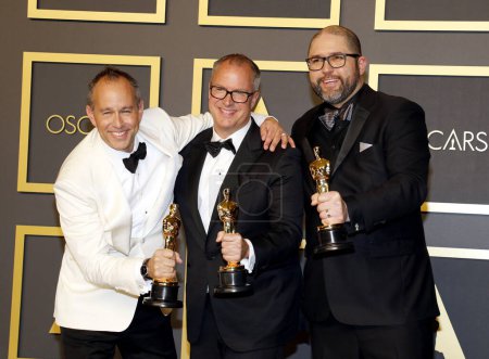 Photo for Jonas Rivera, Mark Nielsen, Josh Cooley posing at the Academy Awards presentation - Royalty Free Image
